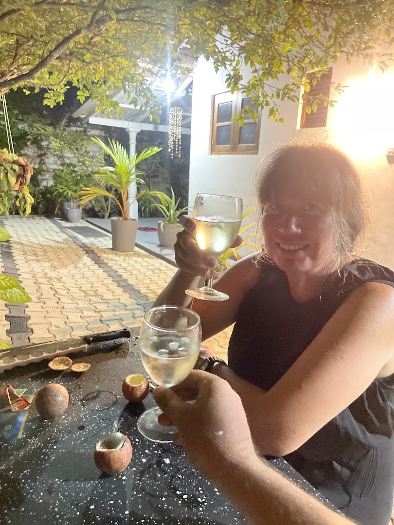 An evening moment at the courtyard table under warm garden lights